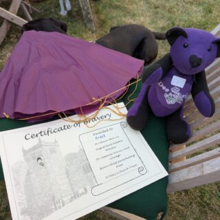 https://deesignchoir.co.uk/wp-content/uploads/2025/08/Roger-and-his-certificate-of-bravery.jpg
