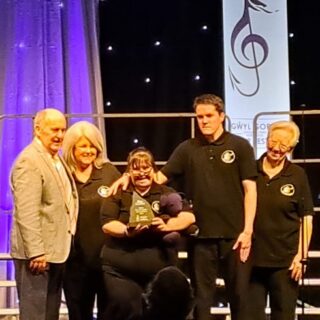 https://deesignchoir.co.uk/wp-content/uploads/2026/02/Dee-Sign-Choir-receive-their-winners-trophy.jpg